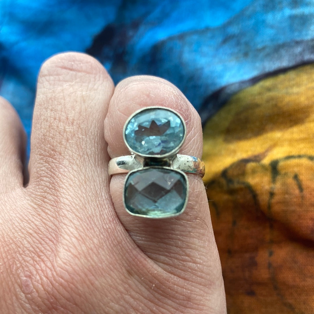 Aquamarine Sterling Silver Ring size 6.75 featuring a blue-green aquamarine crystal set in a polished sterling silver band.
