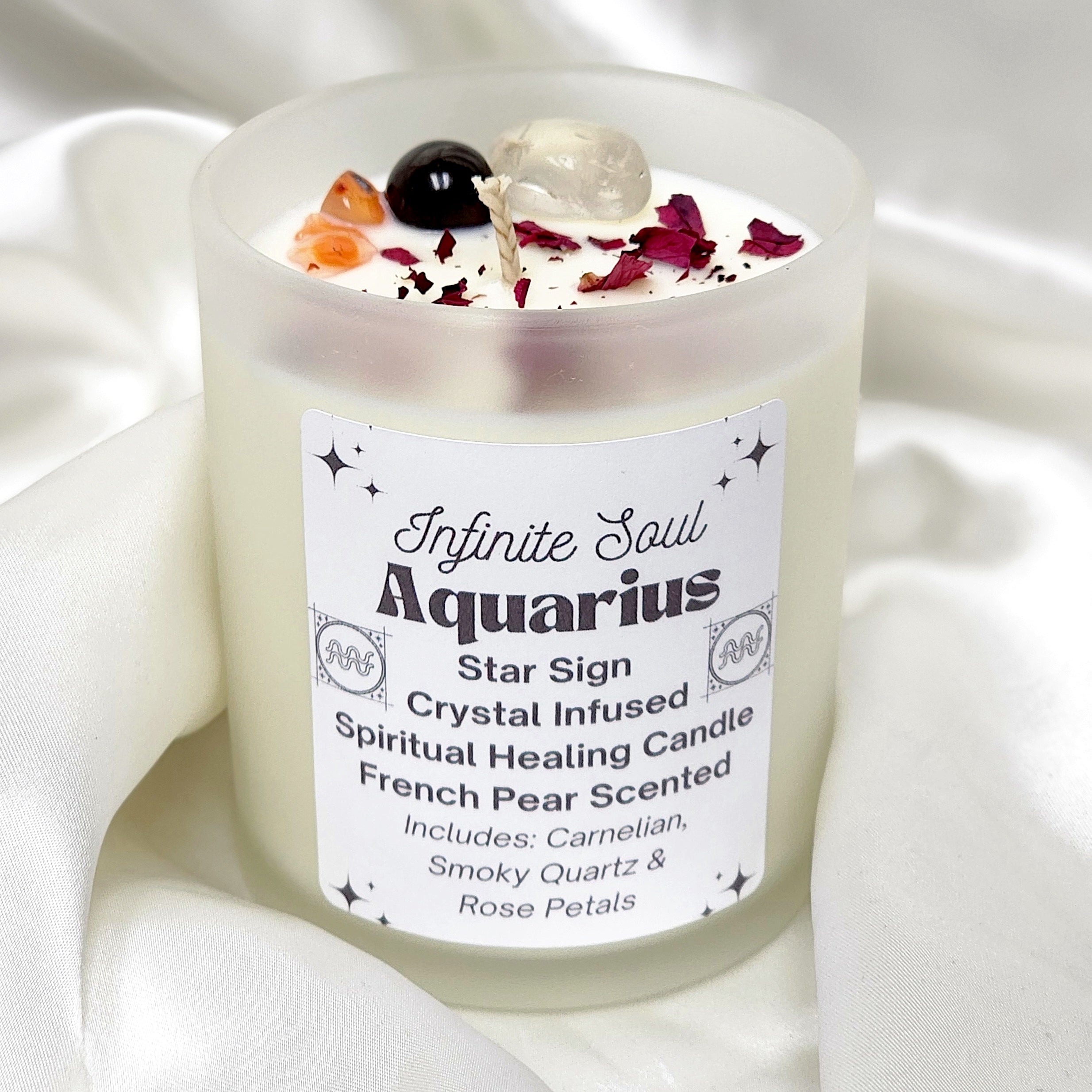 Aquarius Star Sign Crystal Infused Candle with French Pear scent, featuring Carnelian and Smoky Quartz crystals, in a frosted jar.