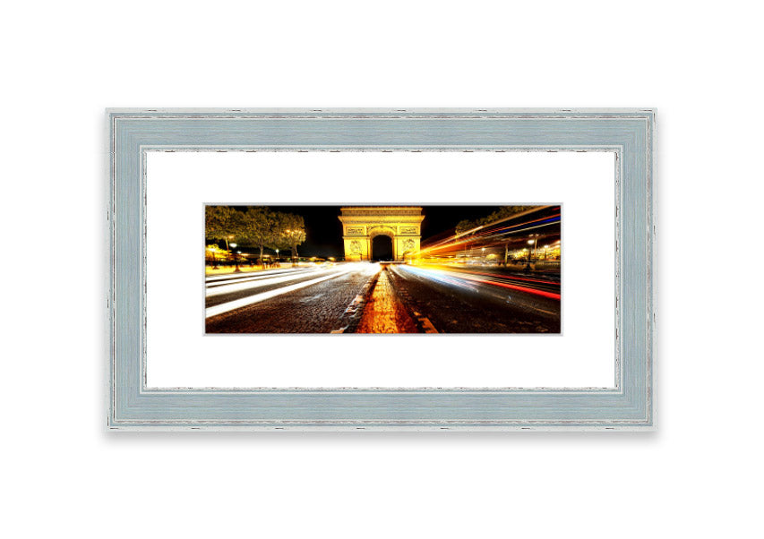 Framed print of the Arc De Triomphe illuminated at night, showcasing its architectural beauty.