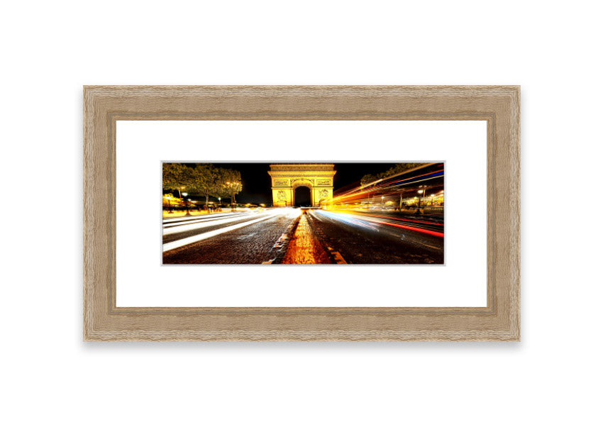Framed print of the Arc De Triomphe illuminated at night, showcasing its architectural beauty.