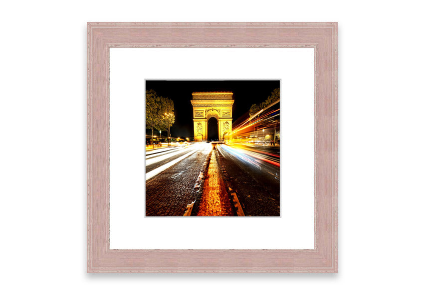 Framed print of the Arc De Triomphe illuminated at night, showcasing its architectural beauty.