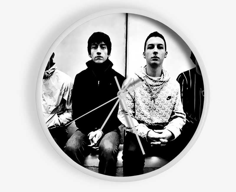 Arctic Monkeys clock made from natural bamboo with a round face, available in black, white, or natural frame colors.