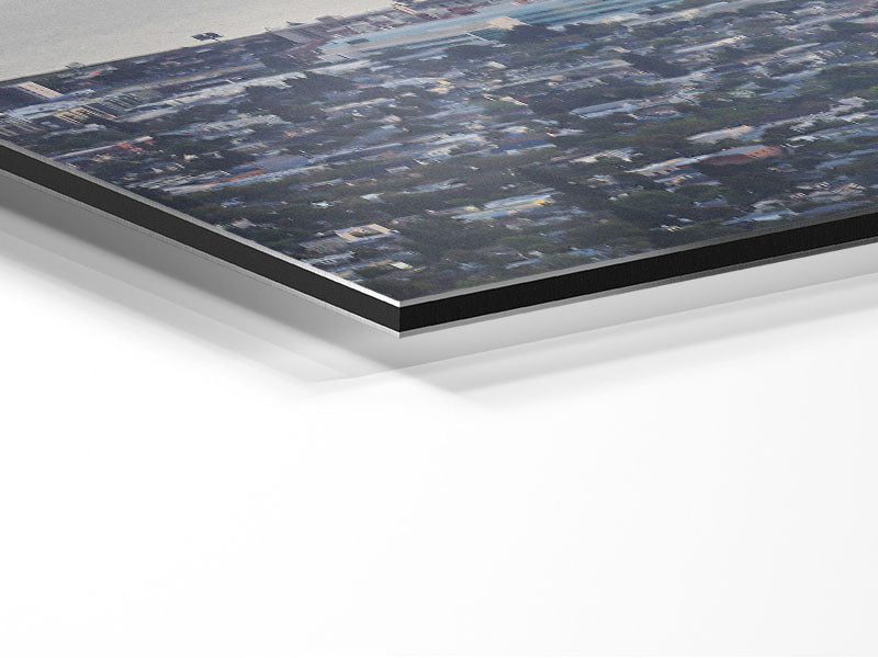 A stunning aerial view of a city printed on brushed aluminium dibond, showcasing modern art with a sleek finish.