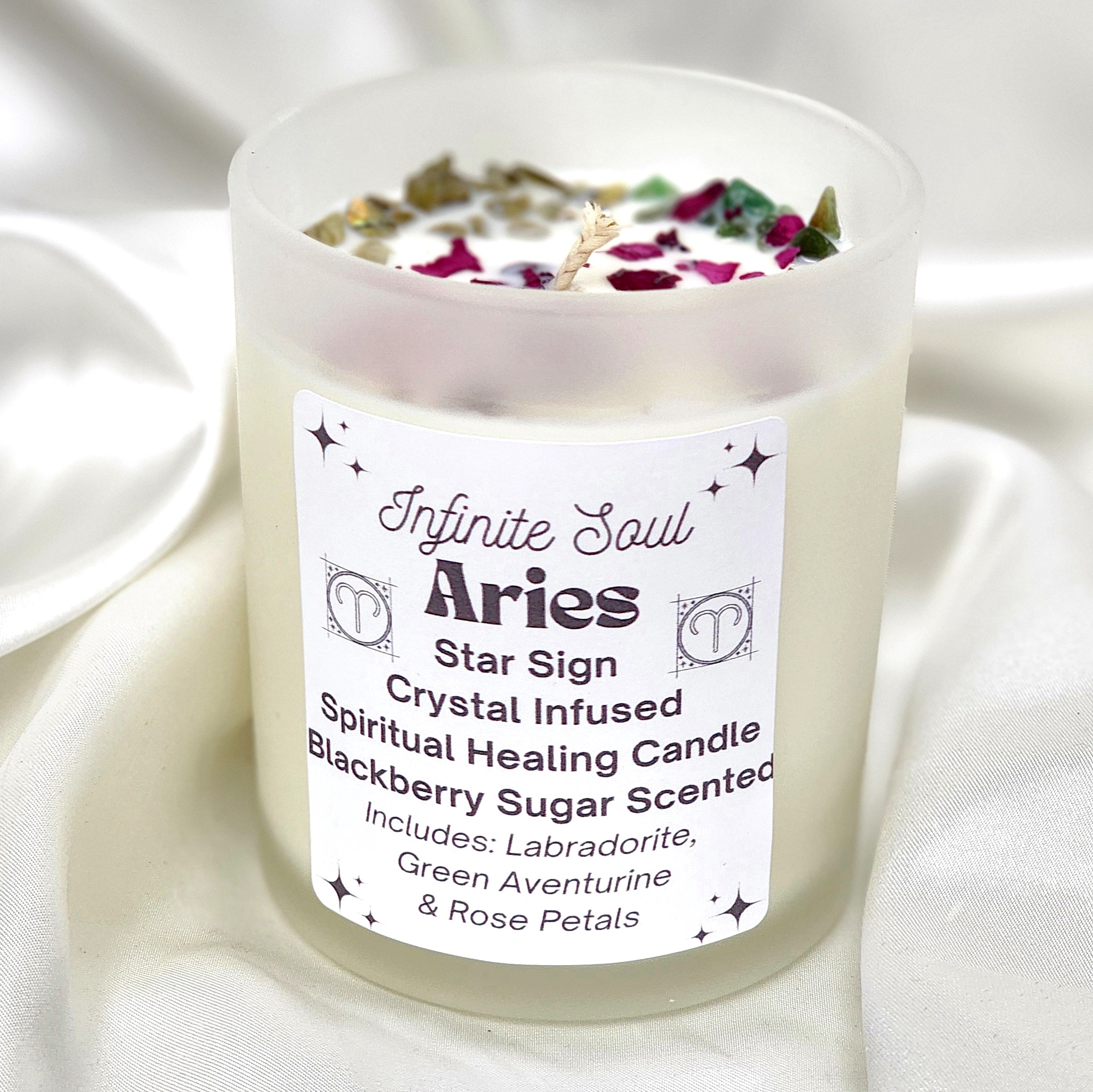 Aries Star Sign Crystal Infused Candle with Blackberry Sugar scent, featuring Labradorite and Green Aventurine crystals, in a clear jar.