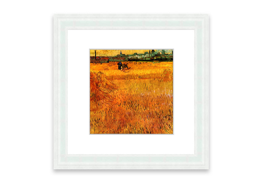 Framed print of Van Gogh's Arles View From The Wheat Fields, showcasing vibrant colors and dynamic brush strokes.