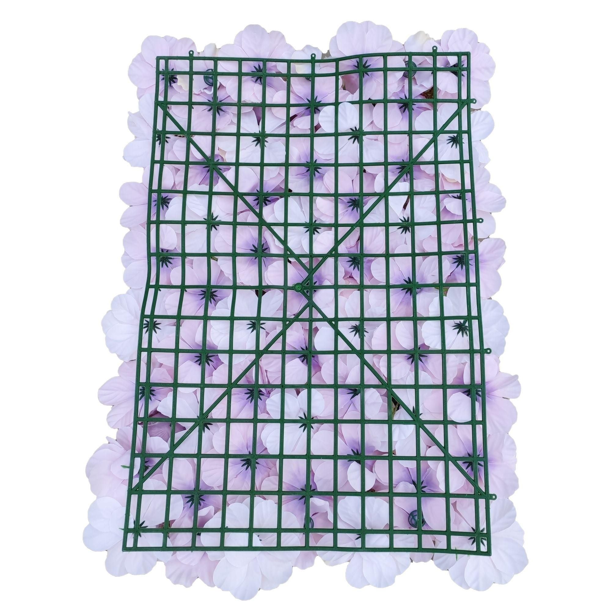 A beautifully arranged artificial flower wall panel featuring vibrant silk pink flowers, perfect for indoor decoration.