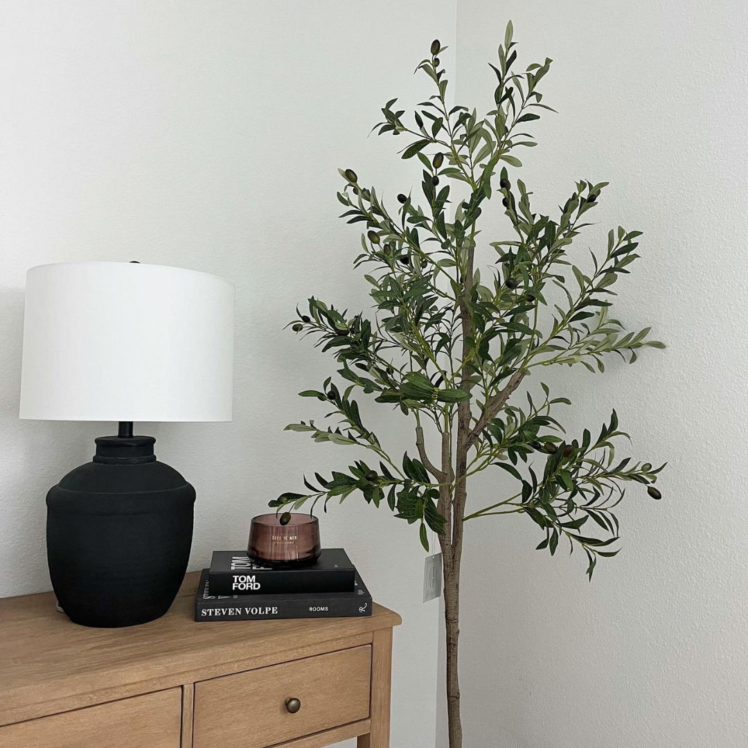 A 6ft tall artificial olive tree with realistic silk leaves in a decorative pot, perfect for home or office decor.
