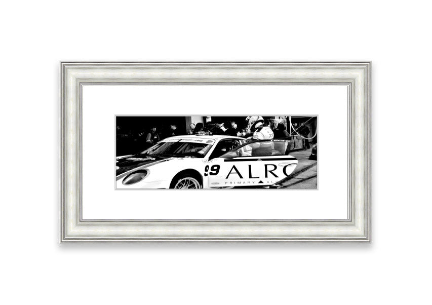 Framed print of Arton Senna preparing for a race, showcasing vibrant colors and detailed craftsmanship.