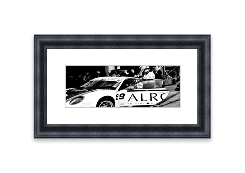 Framed print of Arton Senna preparing for a race, showcasing vibrant colors and detailed craftsmanship.