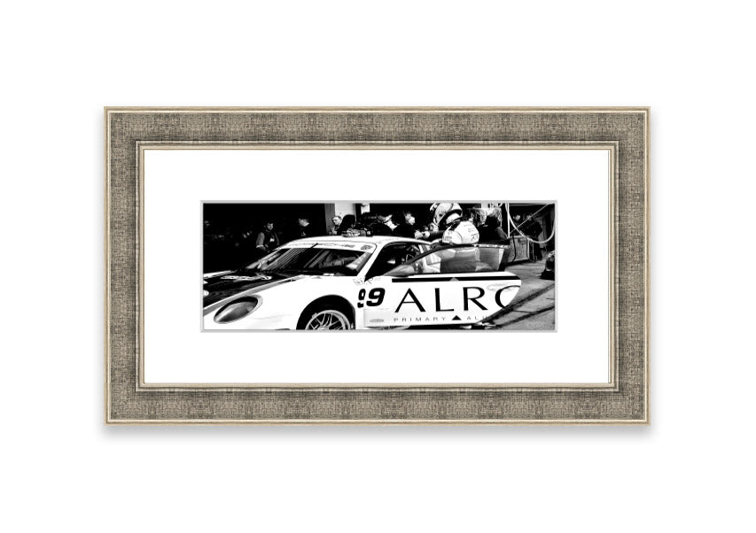 Framed print of Arton Senna preparing for a race, showcasing vibrant colors and detailed craftsmanship.