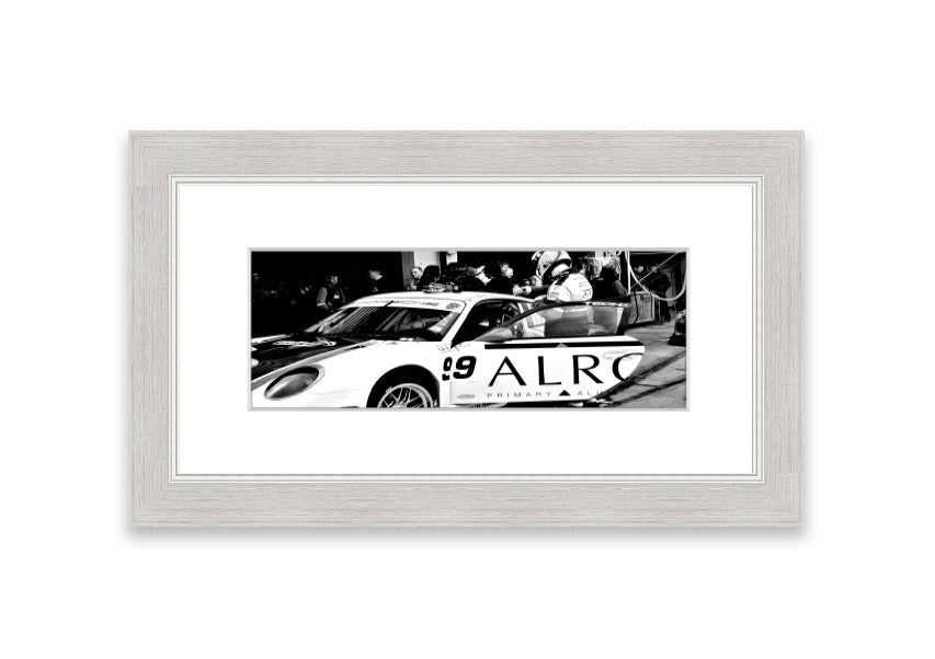 Framed print of Arton Senna preparing for a race, showcasing vibrant colors and detailed craftsmanship.