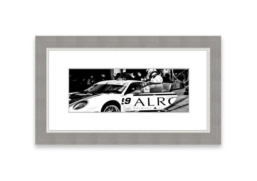 Framed print of Arton Senna preparing for a race, showcasing vibrant colors and detailed craftsmanship.