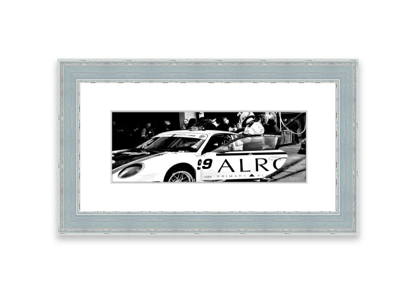 Framed print of Arton Senna preparing for a race, showcasing vibrant colors and detailed craftsmanship.