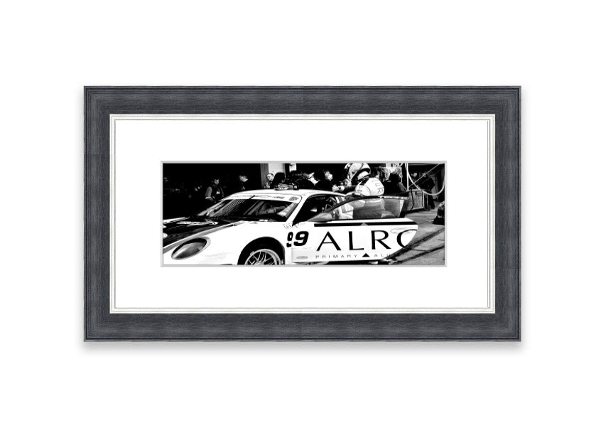 Framed print of Arton Senna preparing for a race, showcasing vibrant colors and detailed craftsmanship.