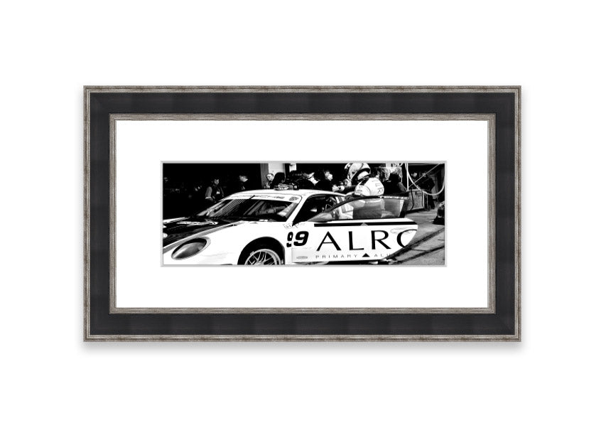 Framed print of Arton Senna preparing for a race, showcasing vibrant colors and detailed craftsmanship.