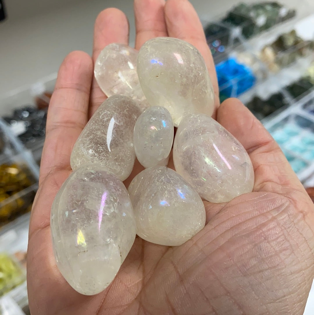 Aura Quartz Tumbled Stone (M) showcasing its iridescent colors and smooth surface, radiating positive energy.