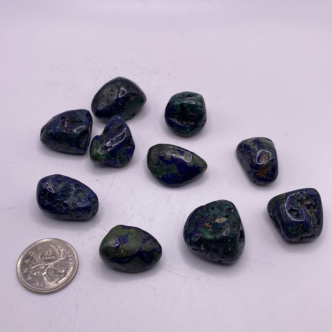A polished Azurite Malachite Tumble showcasing deep blue and vibrant green colors, symbolizing spiritual growth and emotional healing.