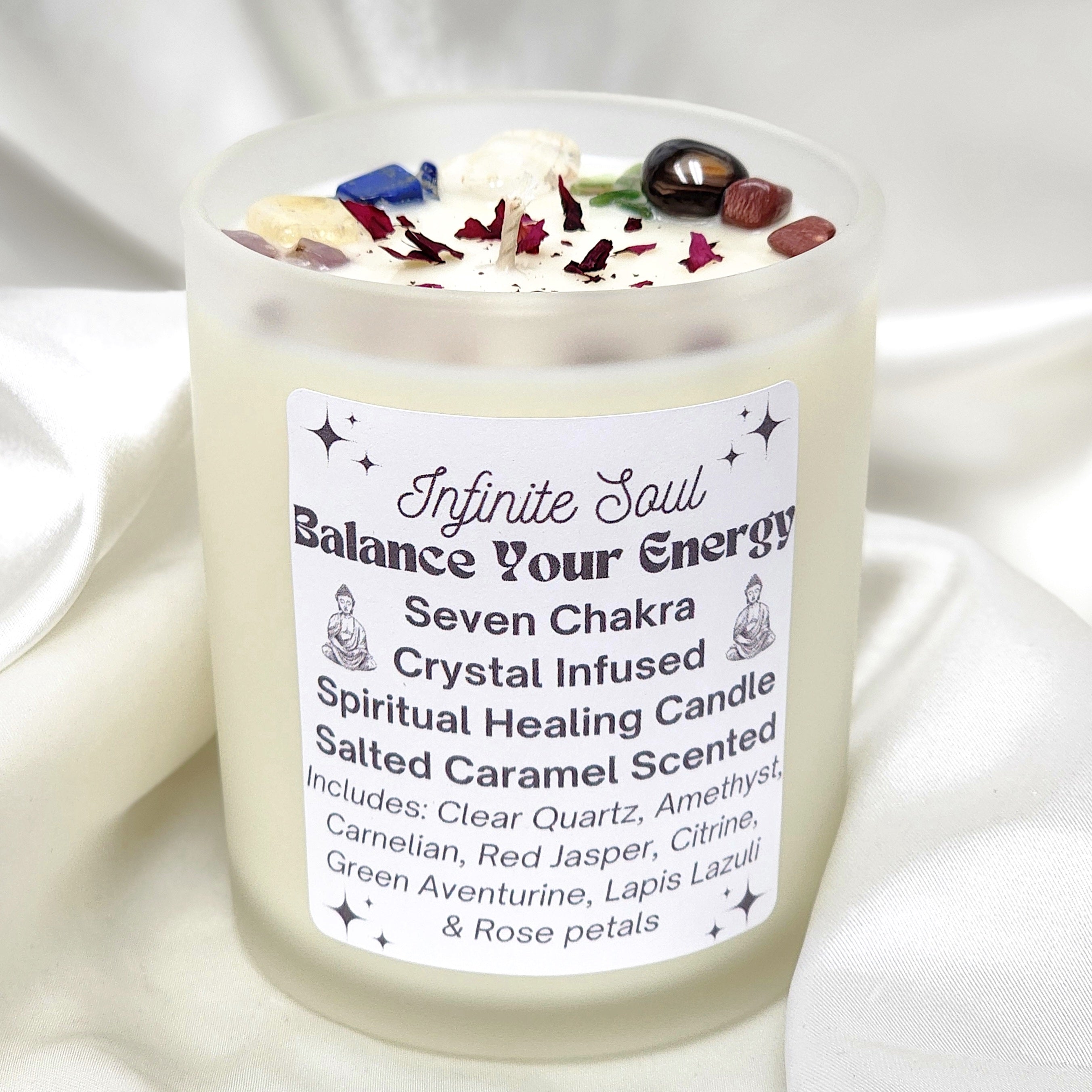 A beautifully crafted Seven Chakra Crystal Infused Candle in a clear jar, featuring various crystals and a salted caramel scent, perfect for chakra healing.