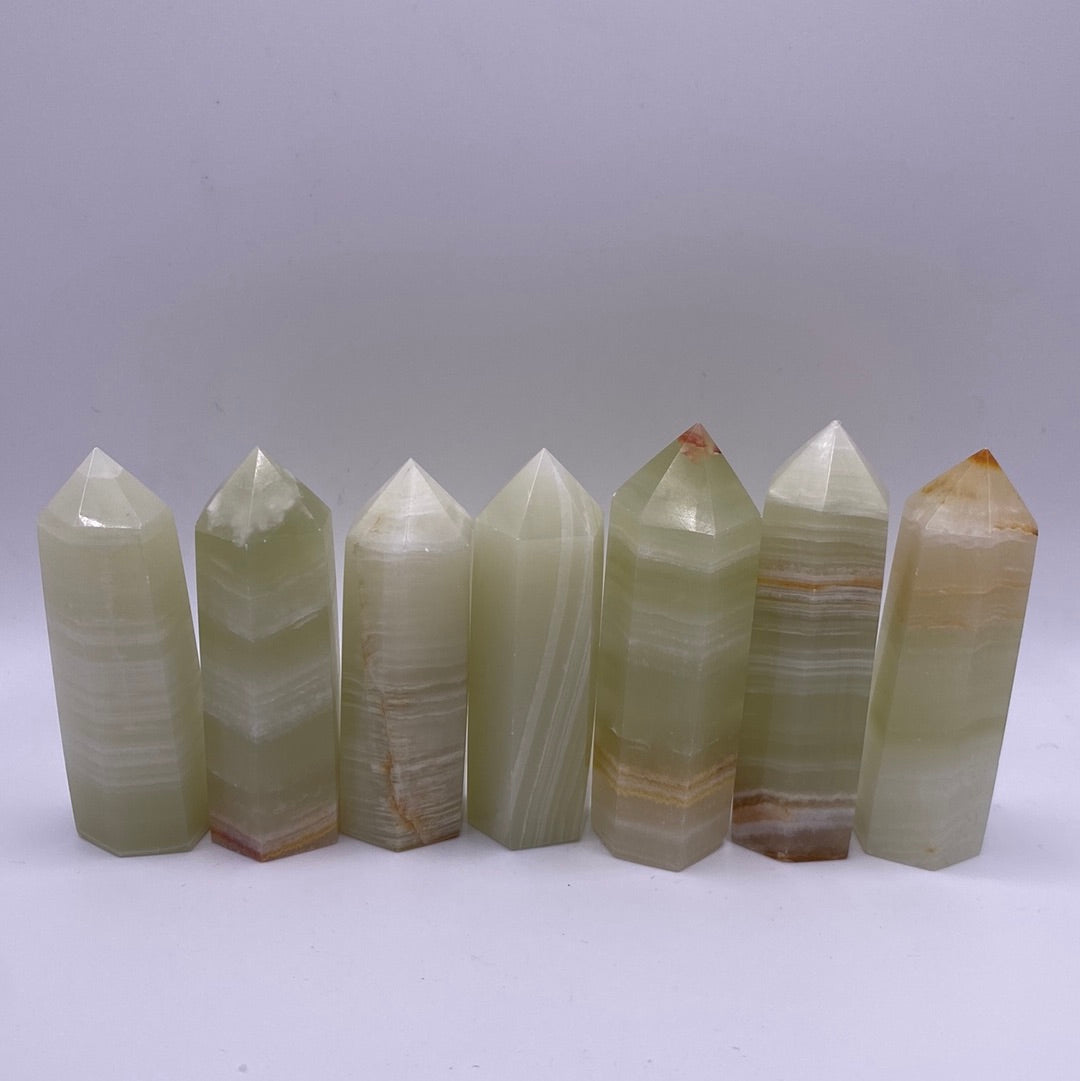 A 2.5-inch tall Banded Onyx Polished Point showcasing unique green and white bands.