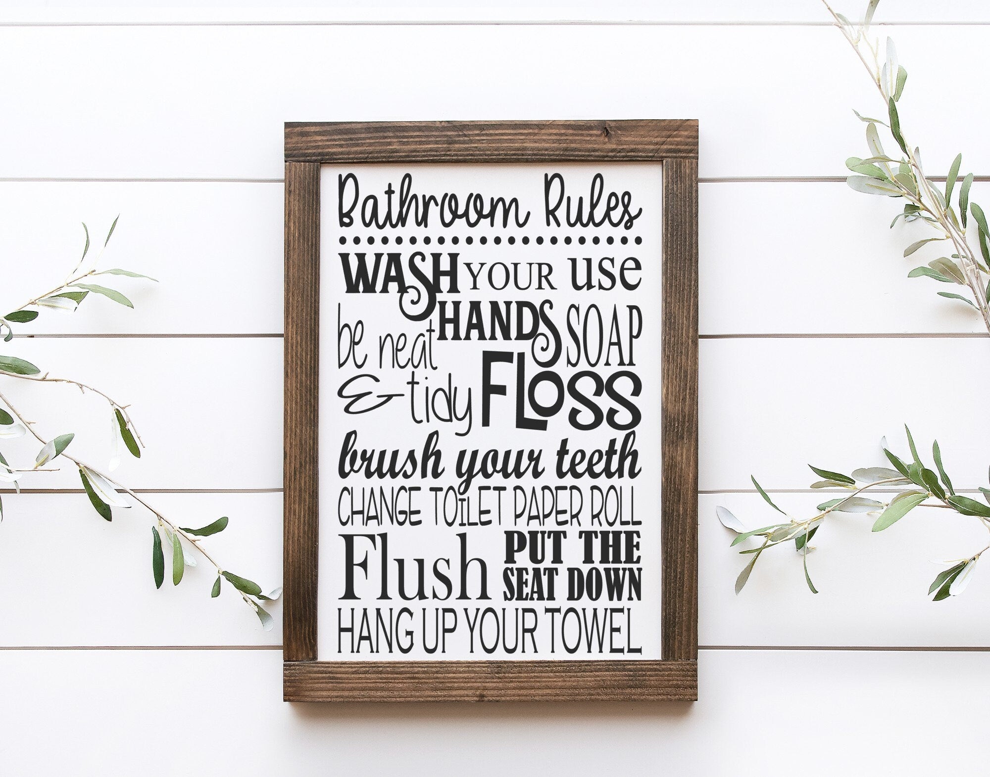 Handmade Bathroom Rules Wood Sign in matte white with painted lettering, showcasing unique wood grain and knots.