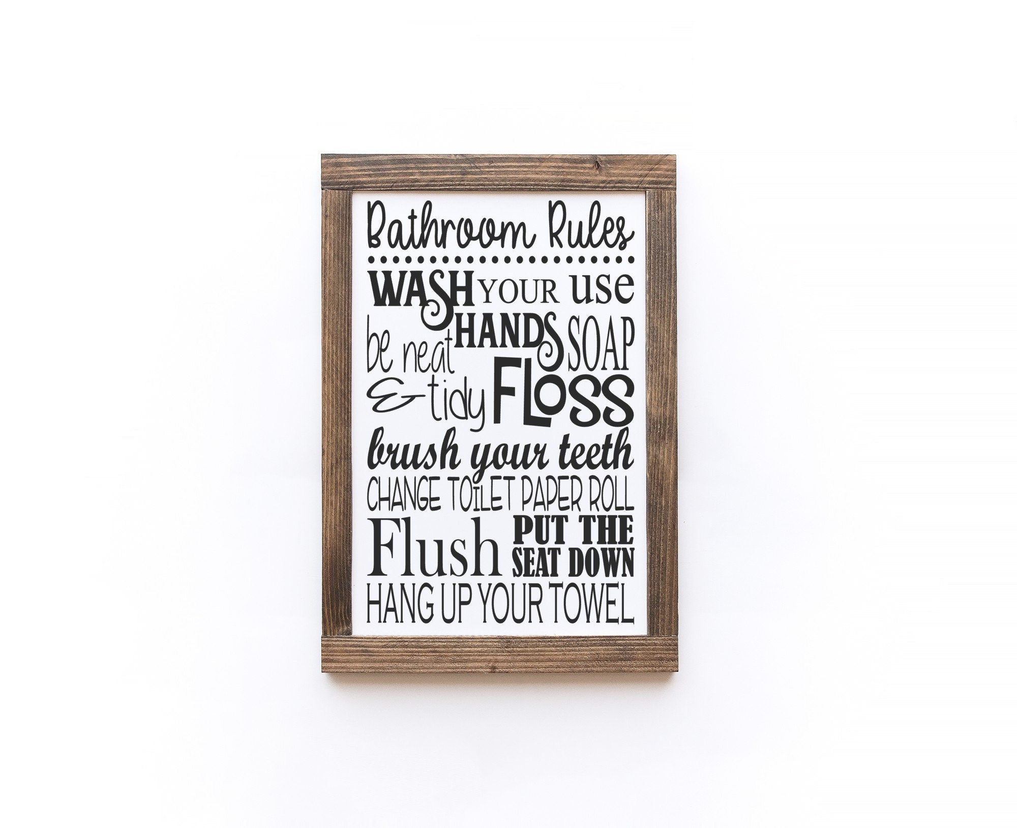 Handmade Bathroom Rules Wood Sign in matte white with painted lettering, showcasing unique wood grain and knots.
