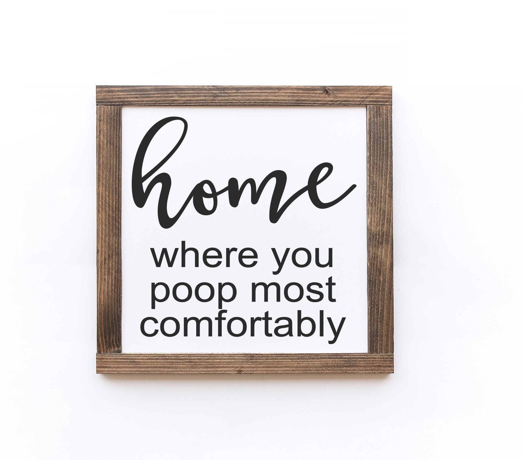 Handmade wooden bathroom sign with matte white finish, showcasing unique wood grain and knots.