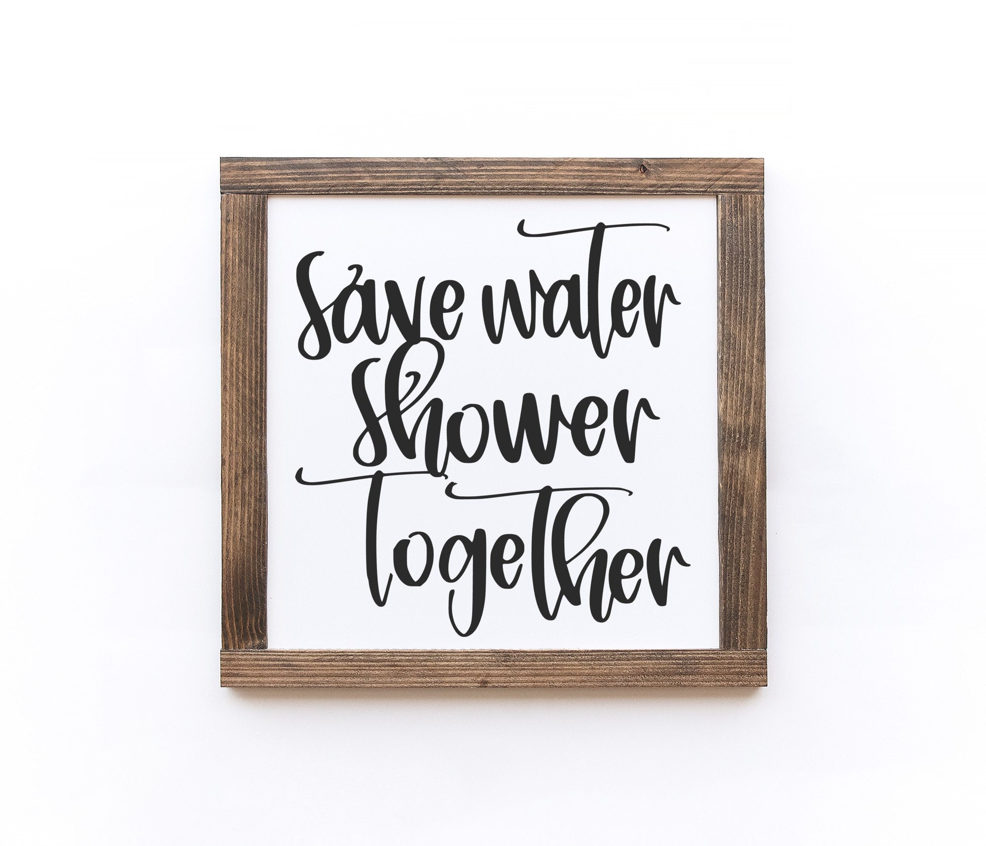 Handmade wooden bathroom sign with matte white finish, showcasing unique wood grain and knots.