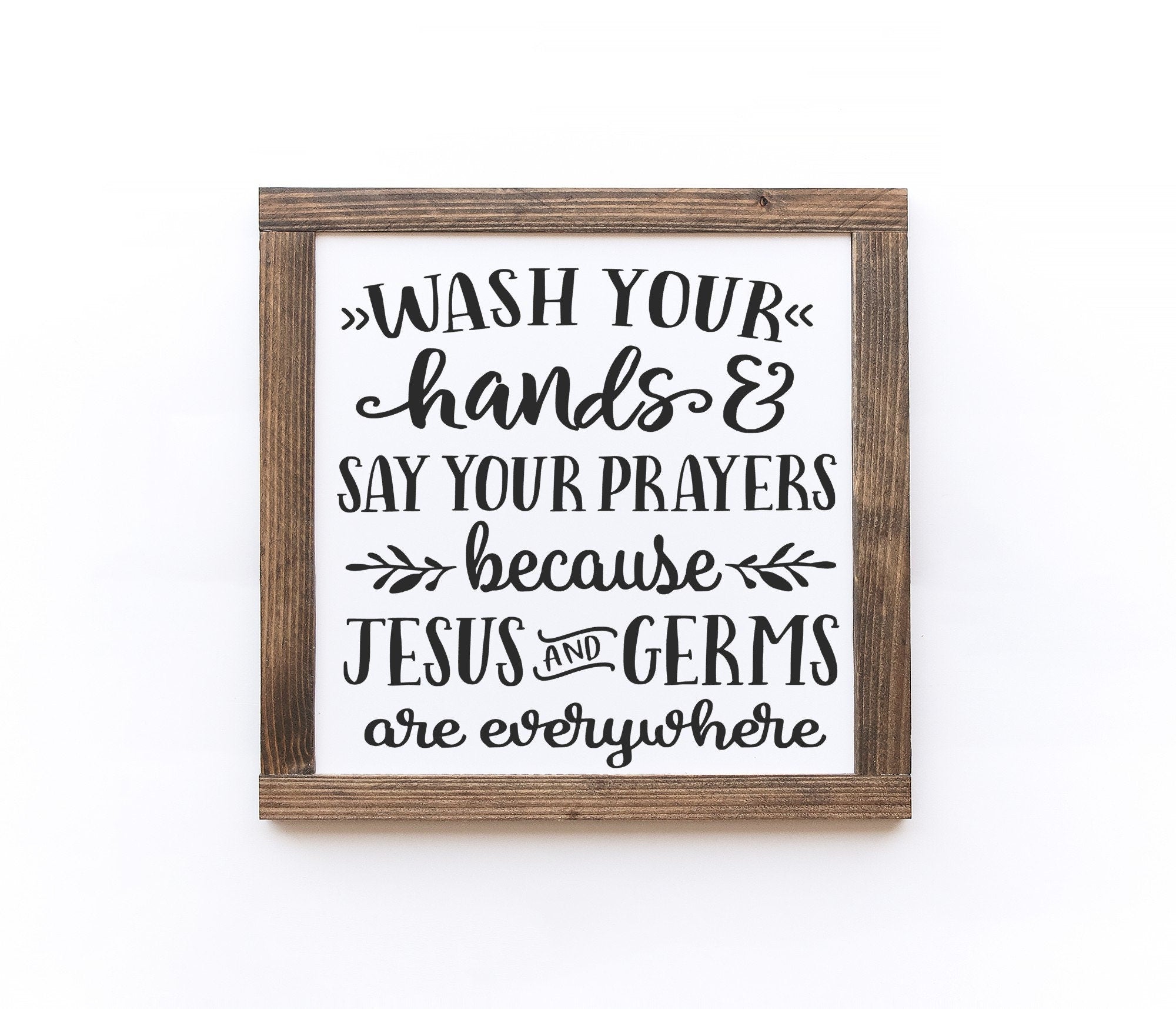 Handmade wooden bathroom sign with matte white finish, showcasing unique wood grain and knots.