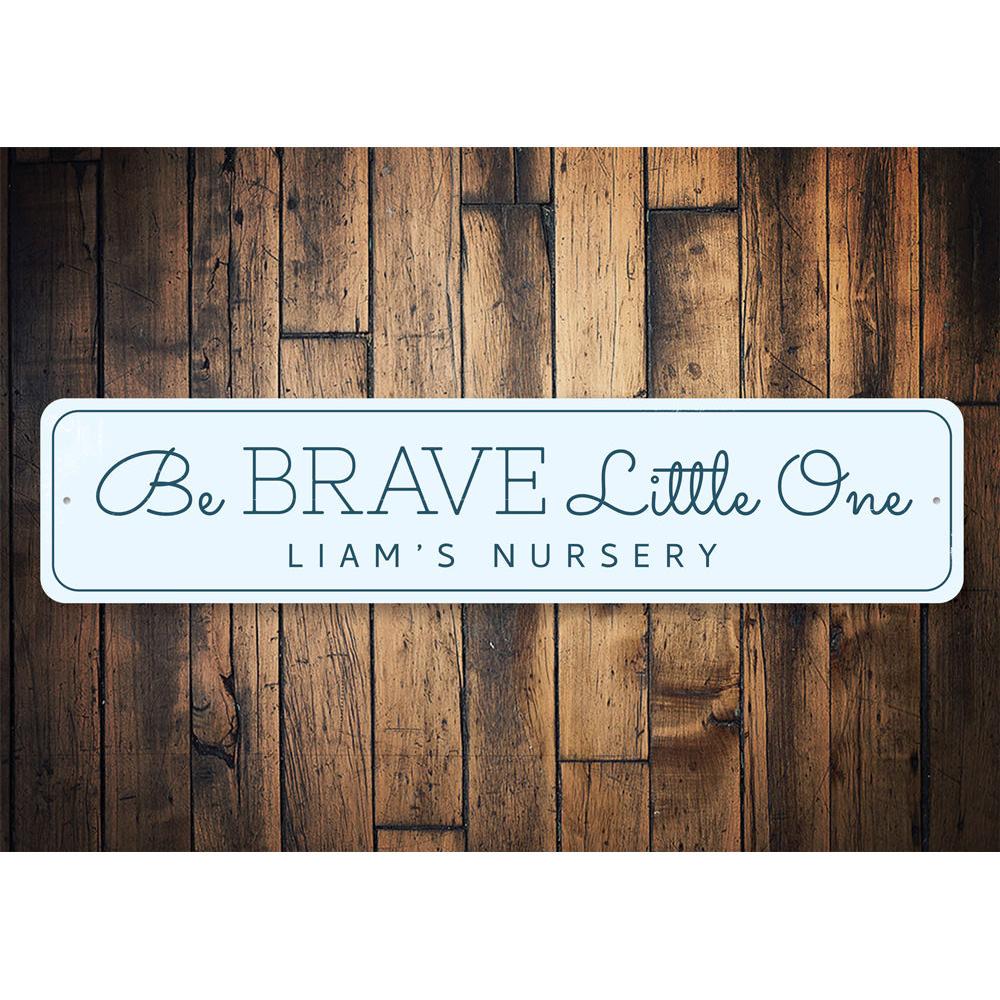 Be Brave Little One Sign, a decorative aluminum wall sign for children's rooms, featuring a whimsical design that inspires courage.