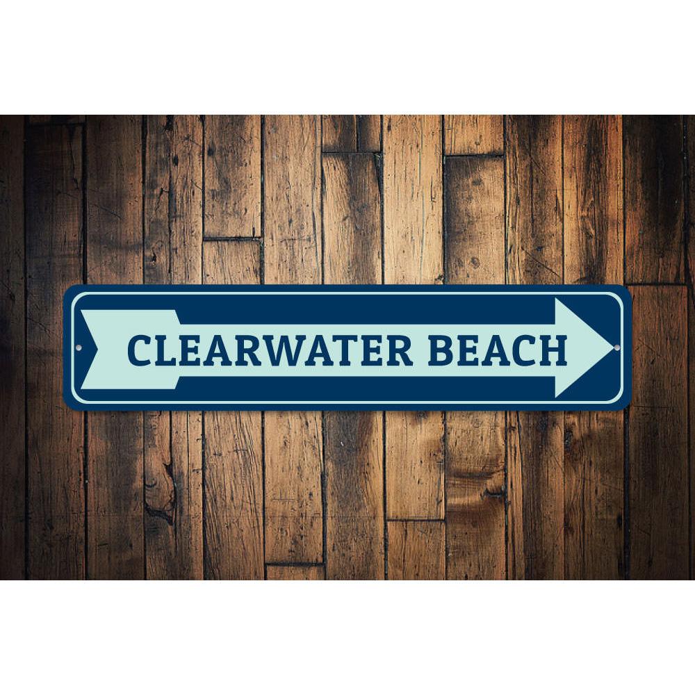 A decorative Beach Arrow Sign made of aluminum, featuring a coastal design perfect for beach houses and outdoor decor.