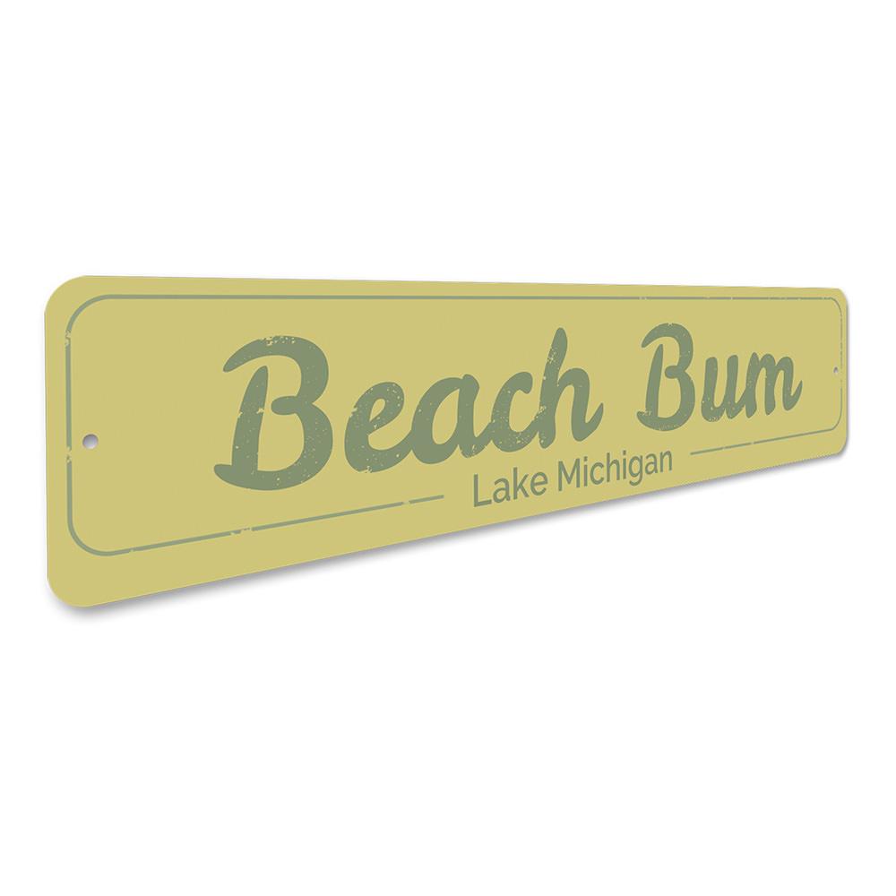 A decorative Beach Bum Sign made of high-quality aluminum, featuring a vibrant design perfect for lakeside cabins.