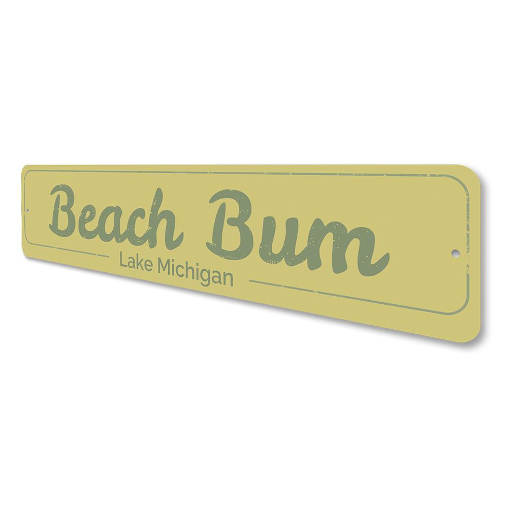 A decorative Beach Bum Sign made of high-quality aluminum, featuring a vibrant design perfect for lakeside cabins.