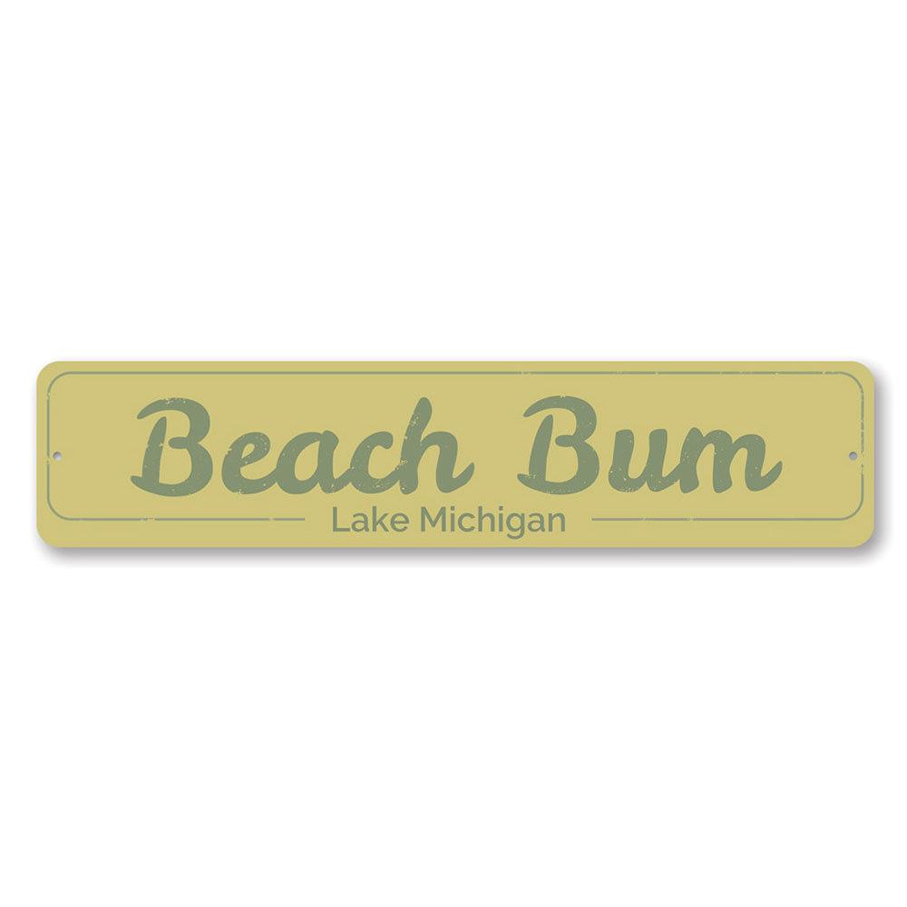 A decorative Beach Bum Sign made of high-quality aluminum, featuring a vibrant design perfect for lakeside cabins.