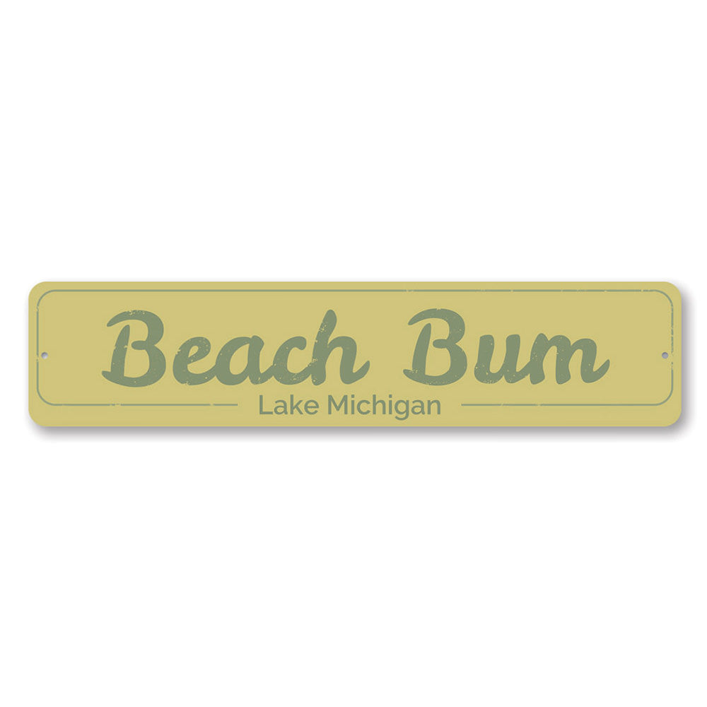 A decorative Beach Bum Sign made of high-quality aluminum, featuring a vibrant design perfect for lakeside cabins.