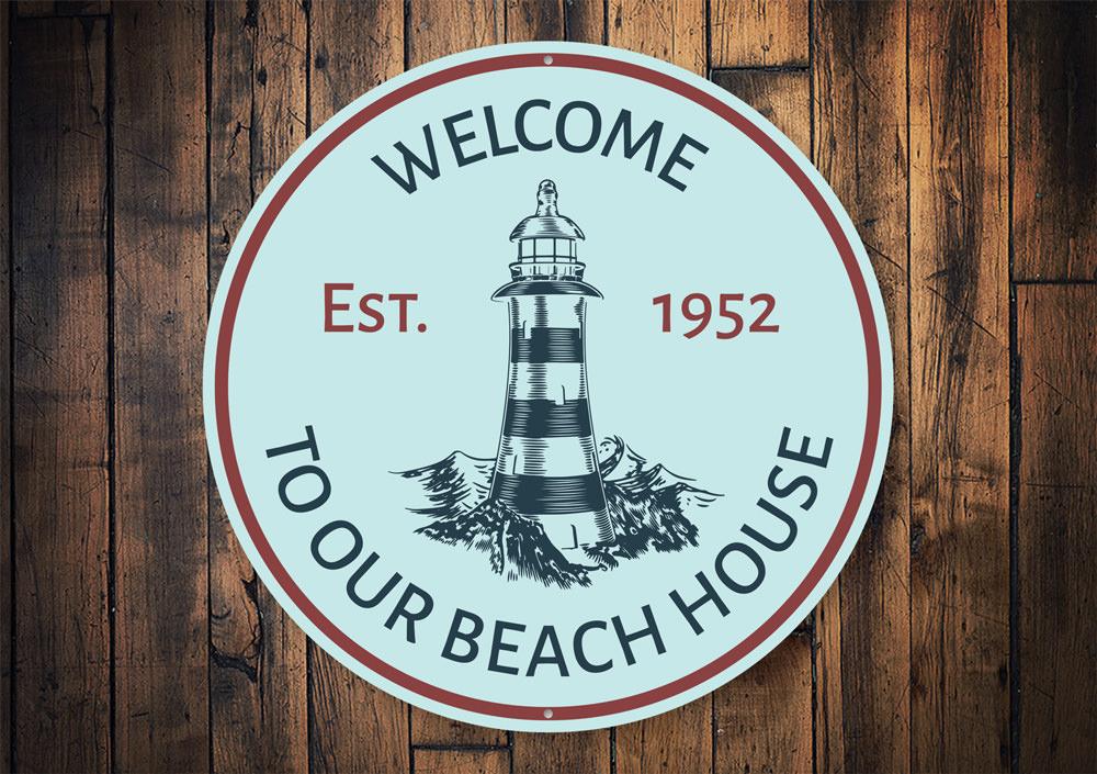 Beach House Lighthouse Sign made of durable aluminum, featuring a coastal design perfect for beach houses and seaside decor.