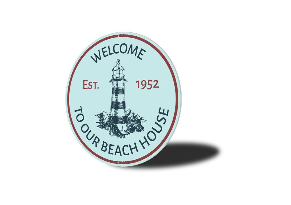 Beach House Lighthouse Sign made of durable aluminum, featuring a coastal design perfect for beach houses and seaside decor.
