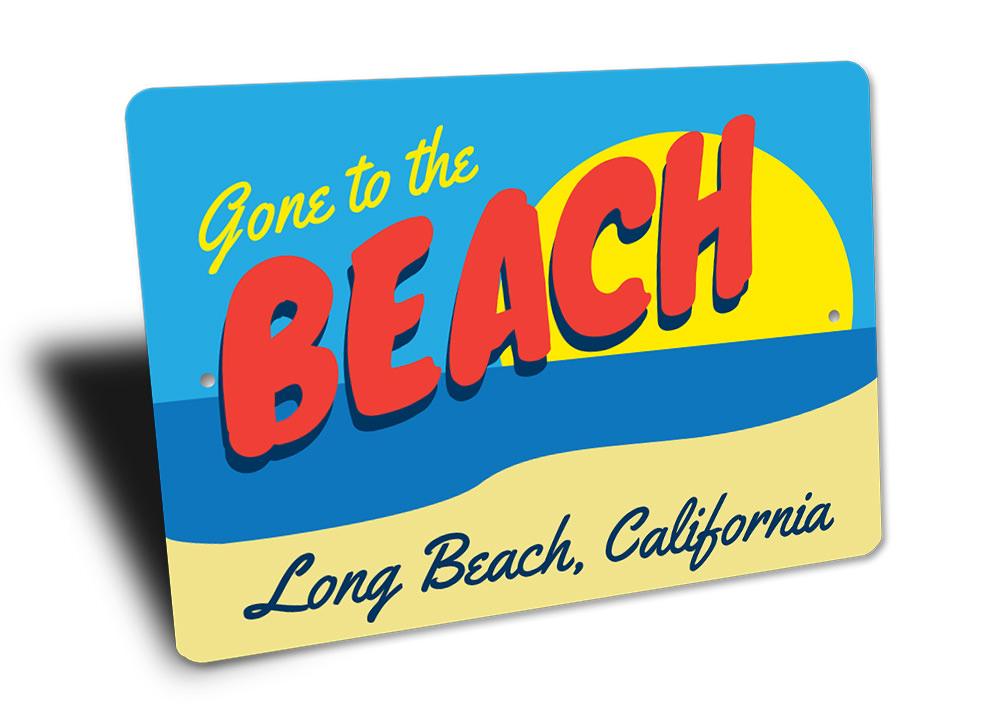 A decorative Beach Scene Sign featuring vibrant coastal imagery, perfect for home decor.