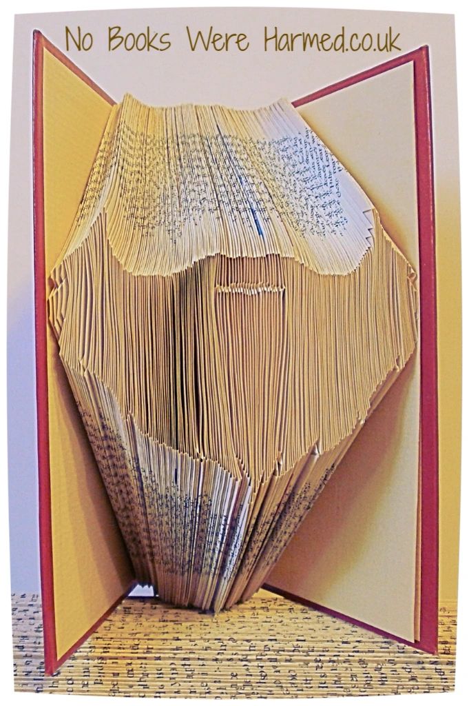 A unique Beard Book Fold art piece made from vintage book pages, showcasing intricate hand-folded designs.