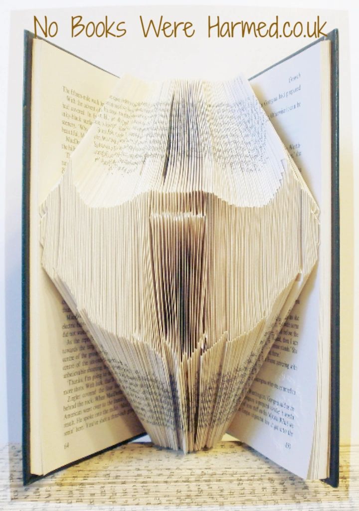 A unique Beard Book Fold art piece made from vintage book pages, showcasing intricate hand-folded designs.
