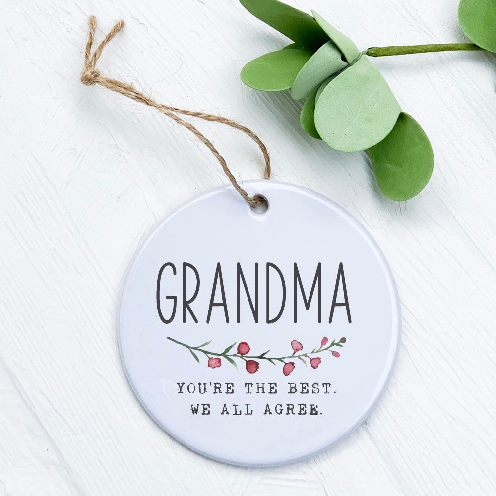 A beautifully crafted porcelain ornament featuring the words 'Best Grandma', showcasing a smooth glossy finish and vibrant design.