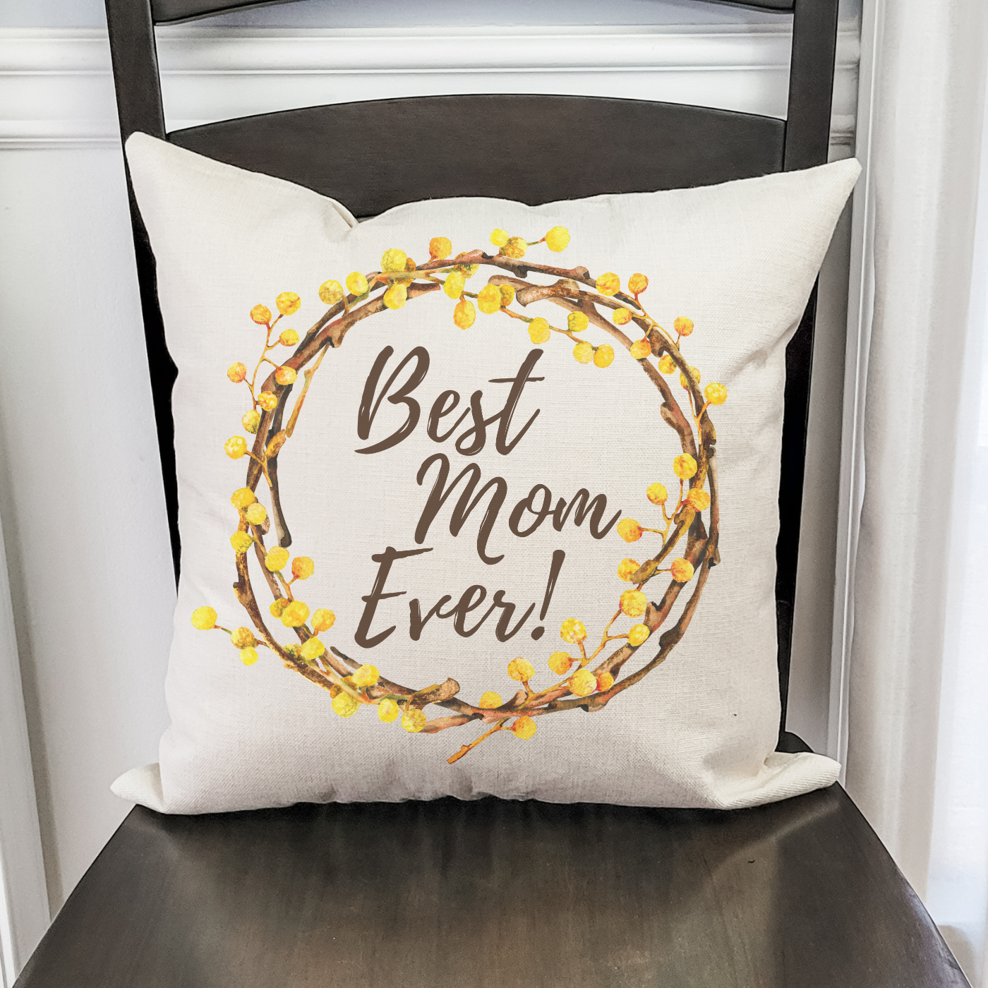Best Mom Ever Wreath Pillow Cover featuring a rustic design with floral accents, made of soft polyester linen, perfect for home decor.