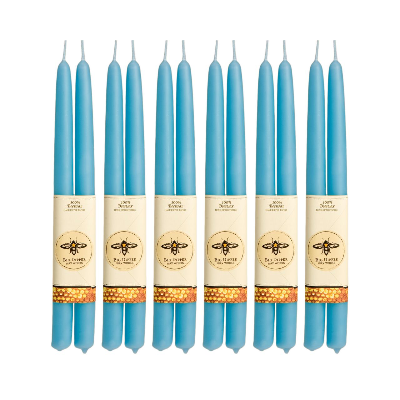 A pair of elegant Big Dipper Wax Works 100% Pure Beeswax STANDARD Tapers, hand-dipped and showcasing a warm golden hue.
