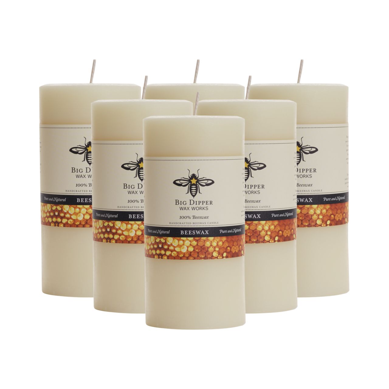 Big Dipper Wax Works All Hallows Eve Beeswax Pillars in natural and ivory colors, showcasing their elegant design and warm glow.