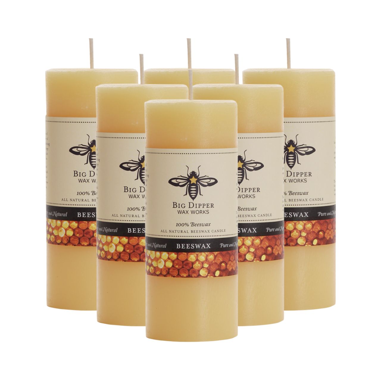 Big Dipper Wax Works All Hallows Eve Beeswax Pillars in natural and ivory colors, showcasing their elegant design and warm glow.