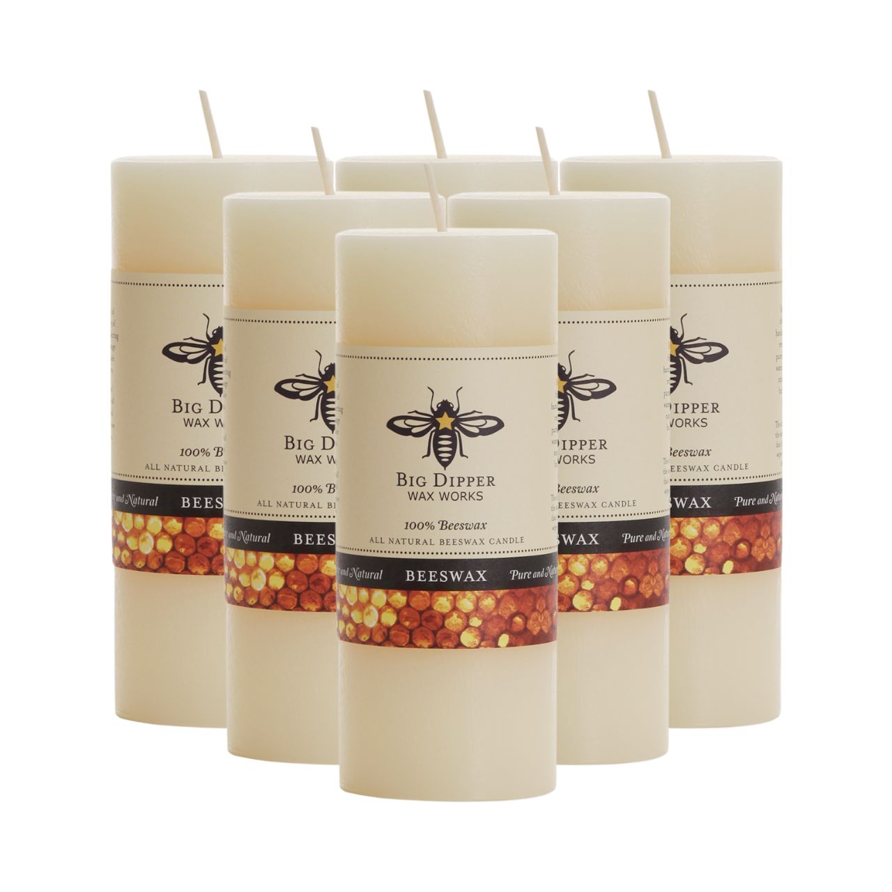 Big Dipper Wax Works All Hallows Eve Beeswax Pillars in natural and ivory colors, showcasing their elegant design and warm glow.