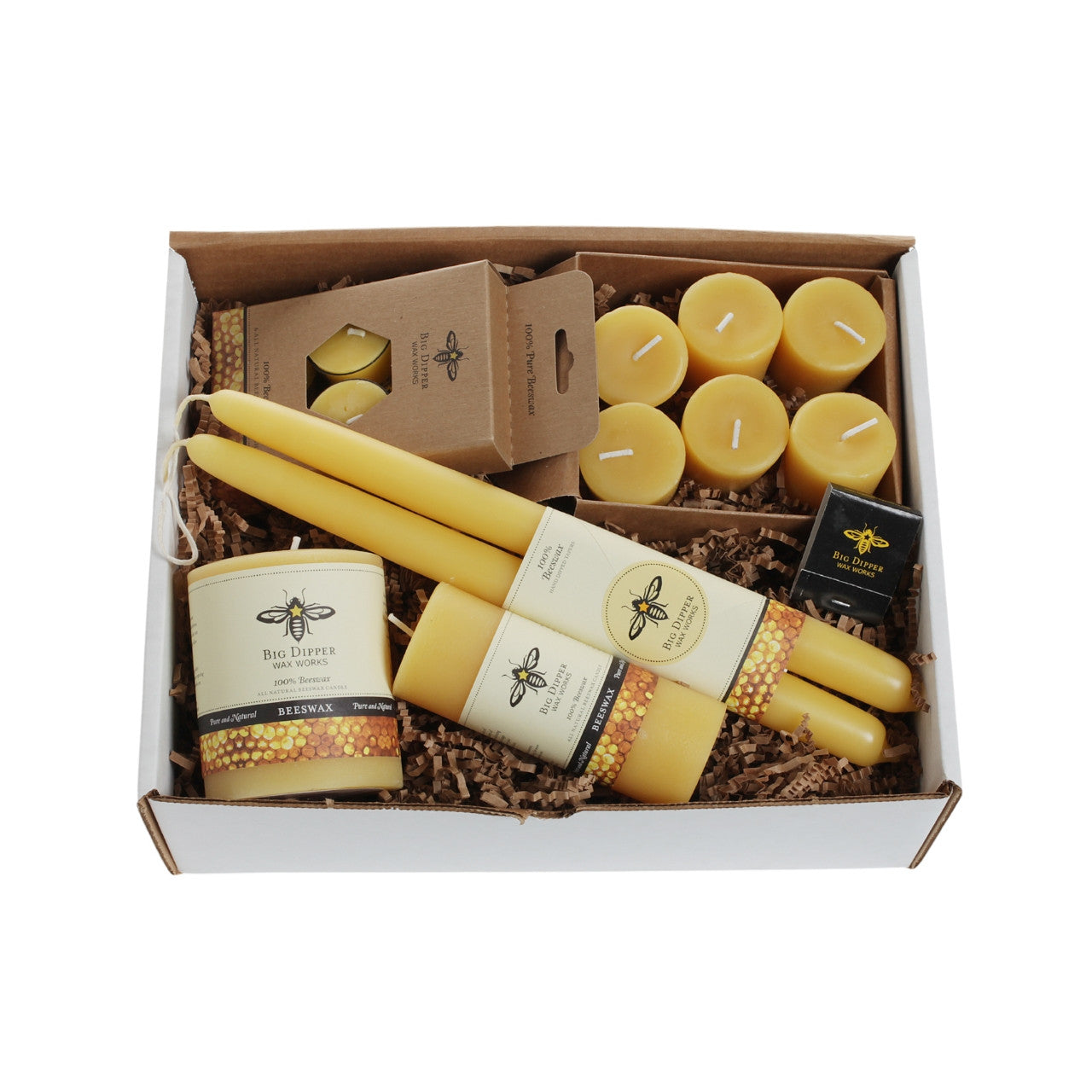 Big Dipper Wax Works Beeswax Candle Sampler featuring various candle types including pillars, tapers, votives, and tea lights in a decorative gift box.