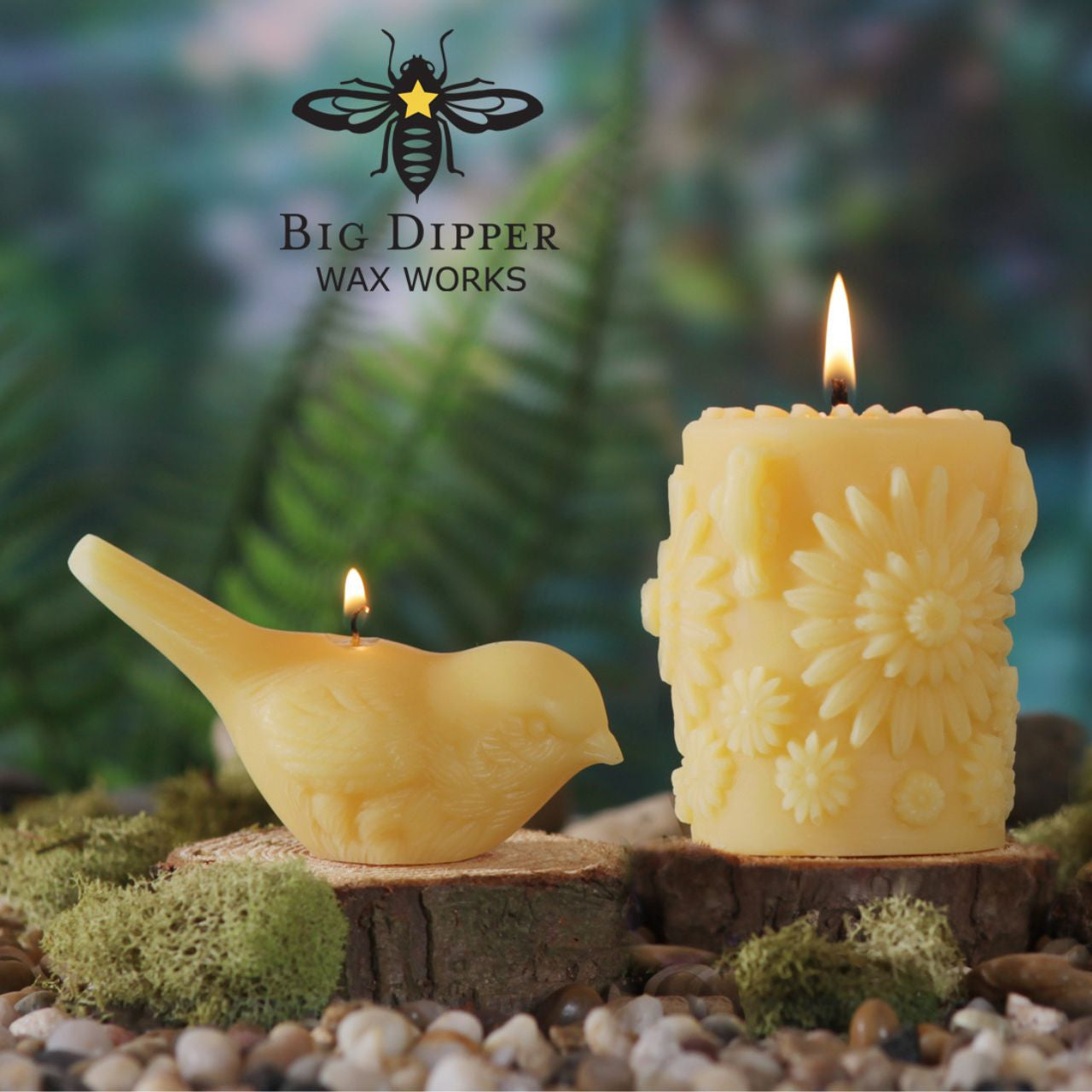 Two handcrafted beeswax song bird candles in upright and pecking positions, showcasing intricate details and natural color.