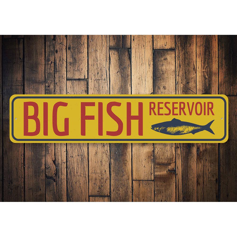 Big Fish Reservoir Sign made of durable aluminum, featuring a unique design perfect for lakehouses, with pre-drilled holes for easy mounting.