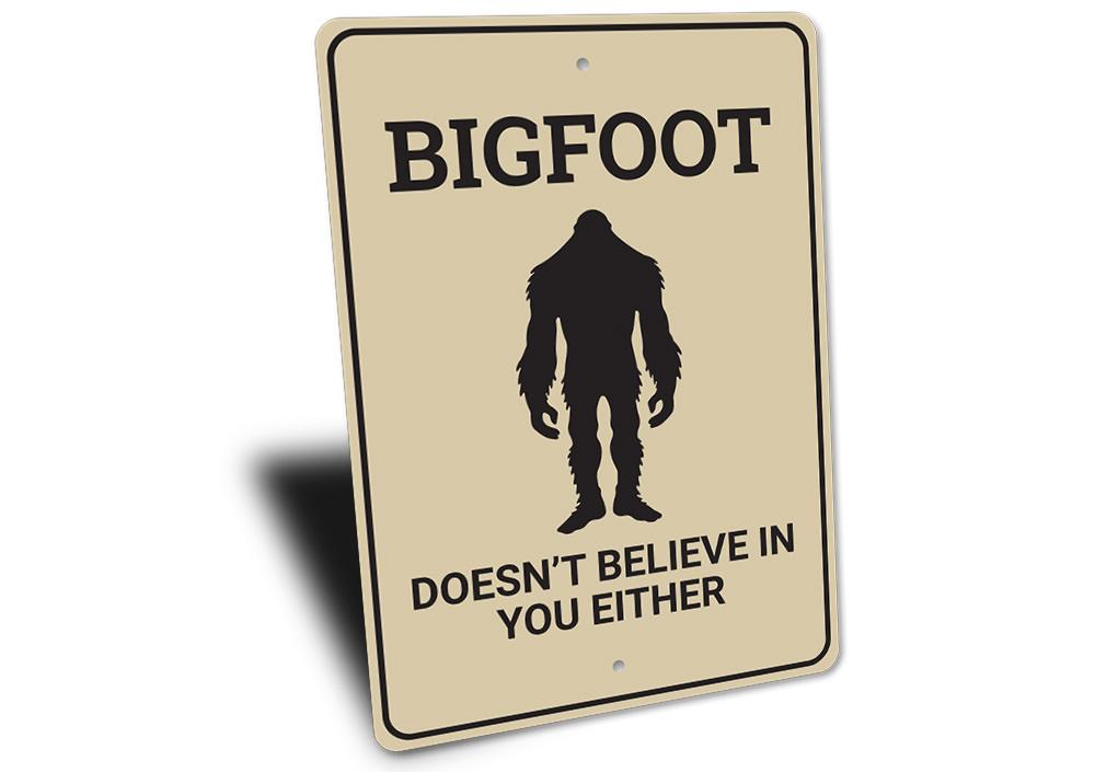 Bigfoot Doesn't Believe in You decorative sign made of aluminum, featuring humorous text and designed for wall mounting.