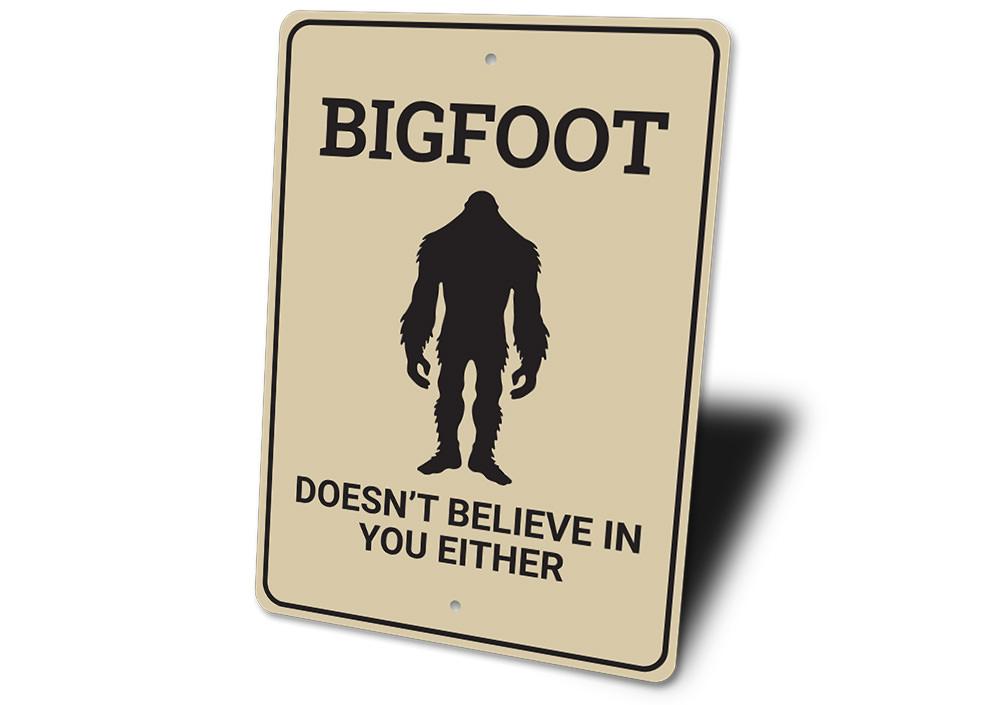 Bigfoot Doesn't Believe in You decorative sign made of aluminum, featuring humorous text and designed for wall mounting.